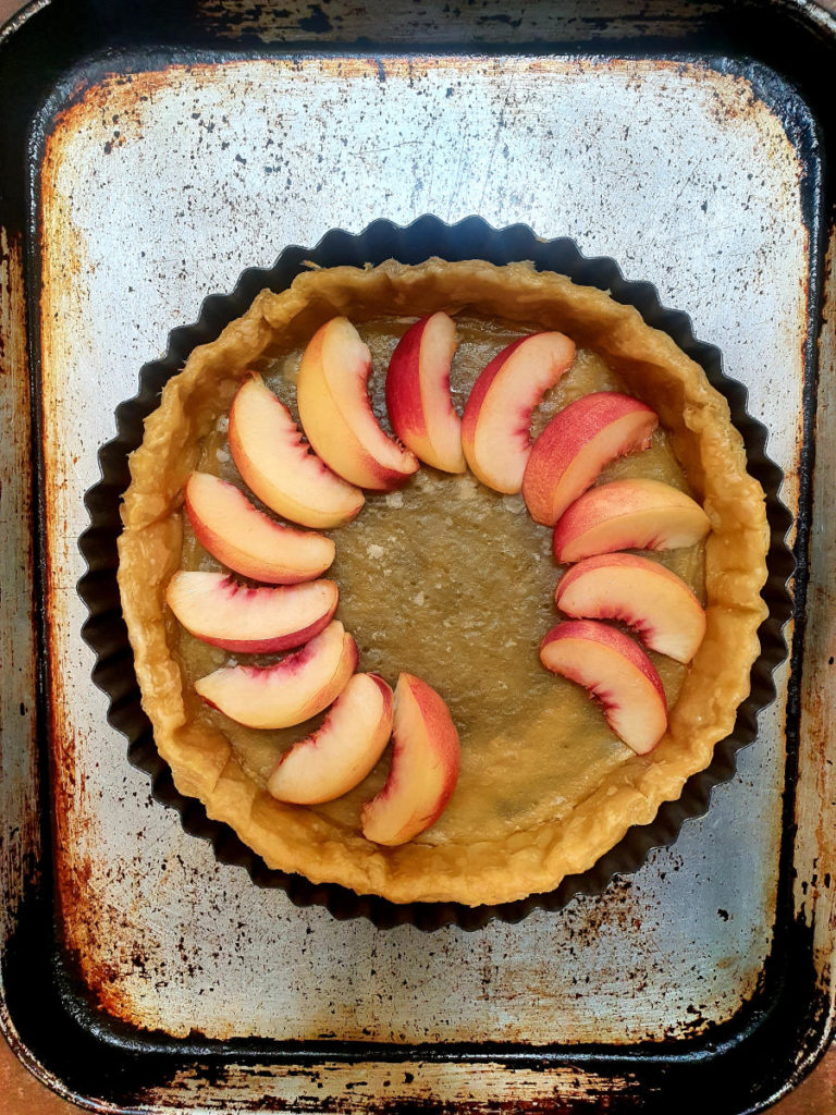 Adding nectarine slices to tart shell