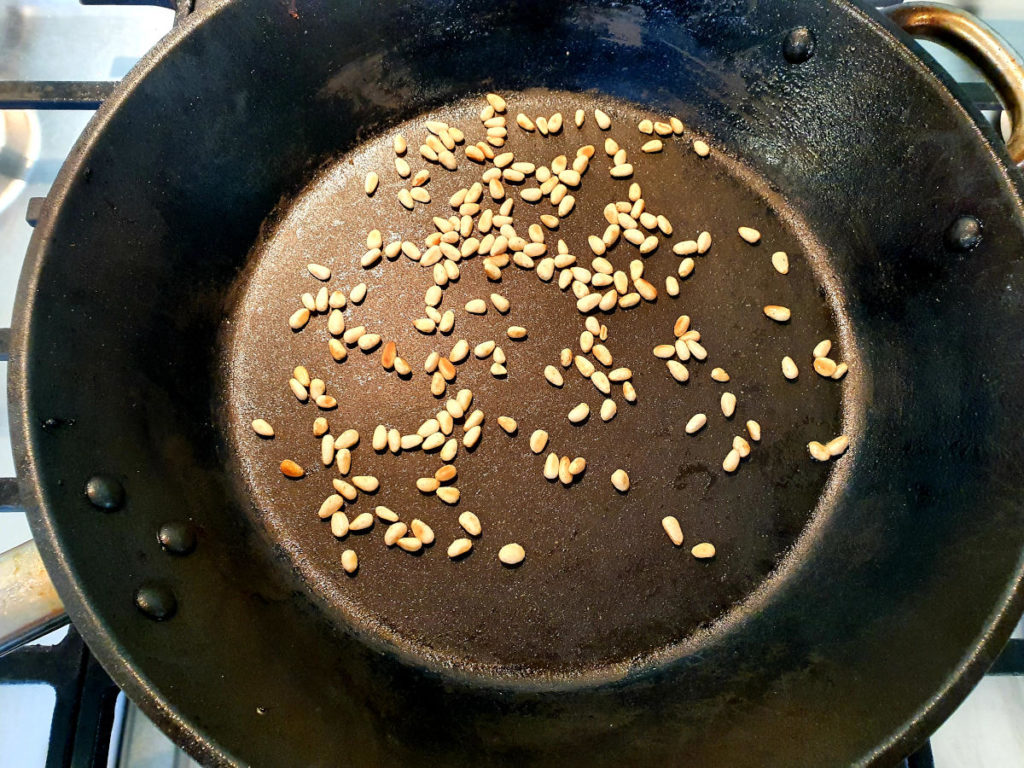 Dry roasting pine nuts at start