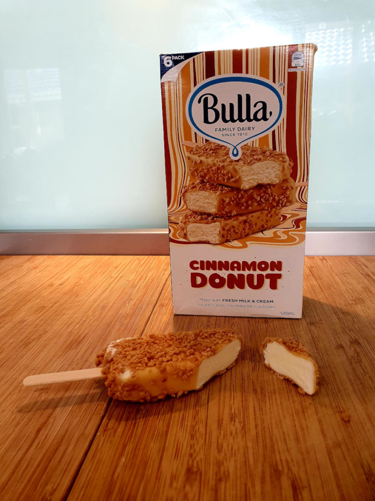 Cut open bulla cinnamon donut ice cream and box