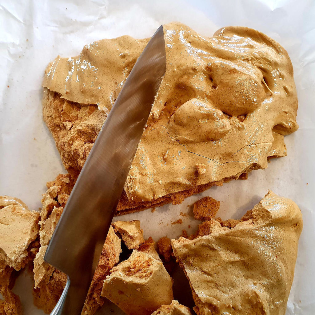 breaking up honeycomb with the back of a knife