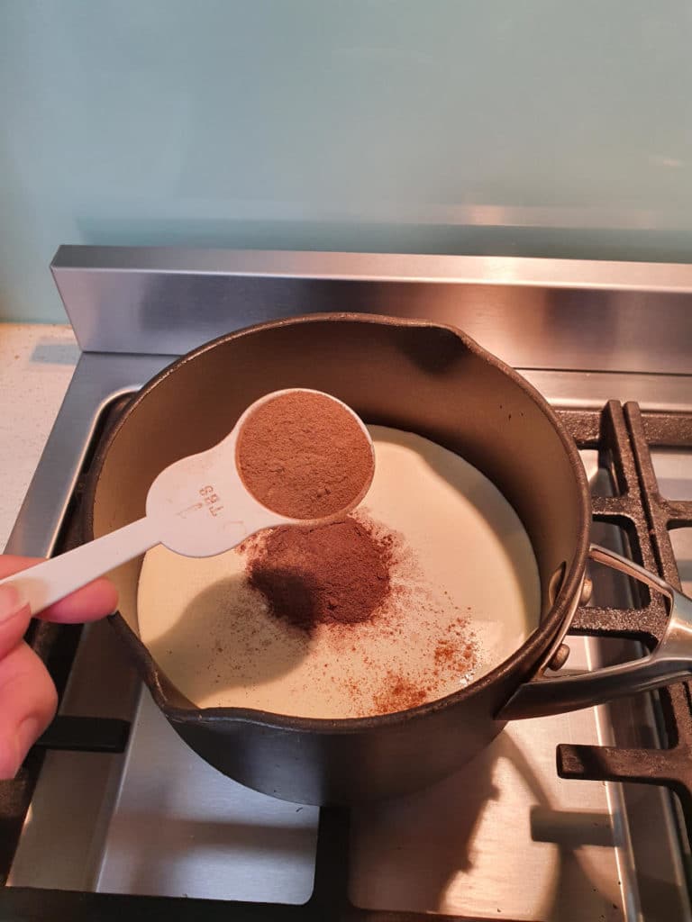 Adding cinnamon to pot