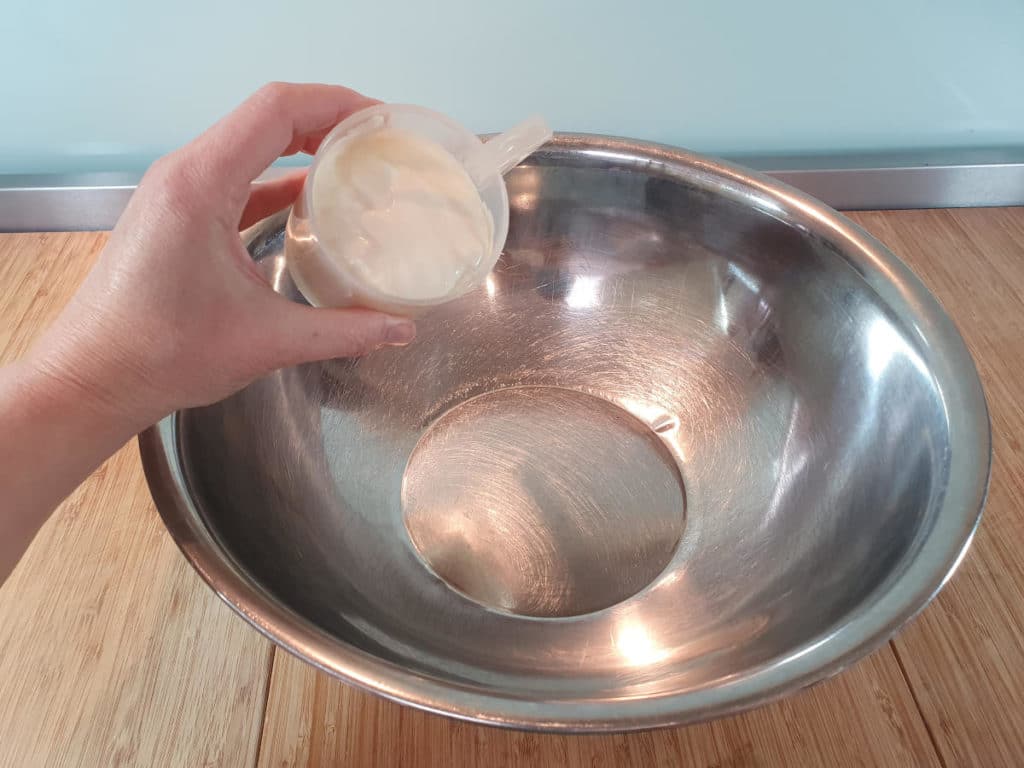 Adding cream to bowl