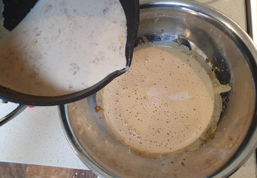 Adding milk mix to egg yokes and sugar