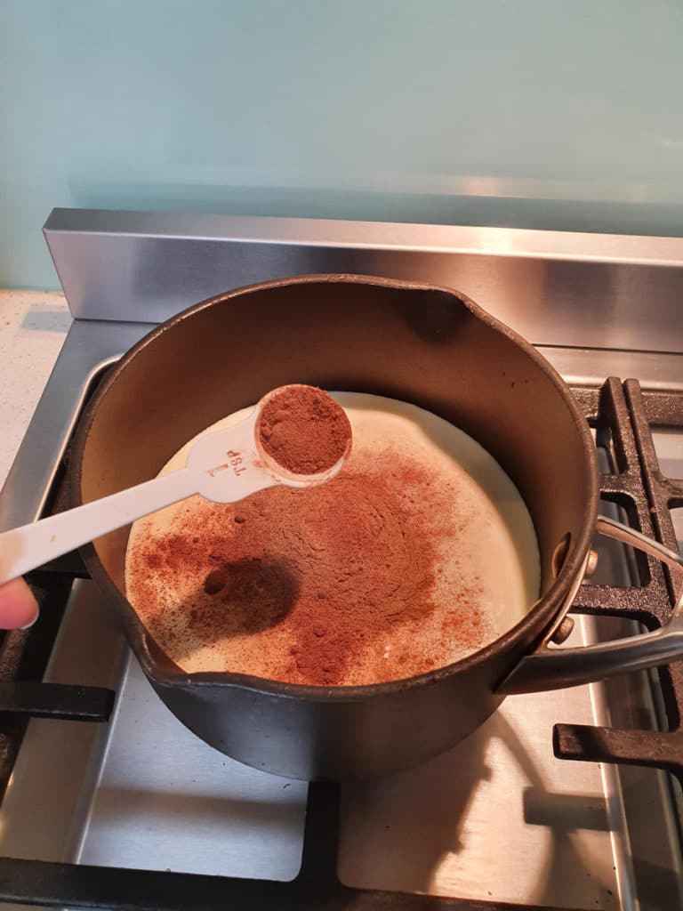 Hot cross bun ice cream 5 Adding nutmeg to pot