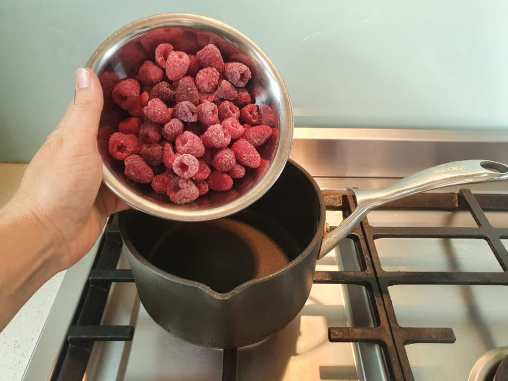 Adding raspberries to pot