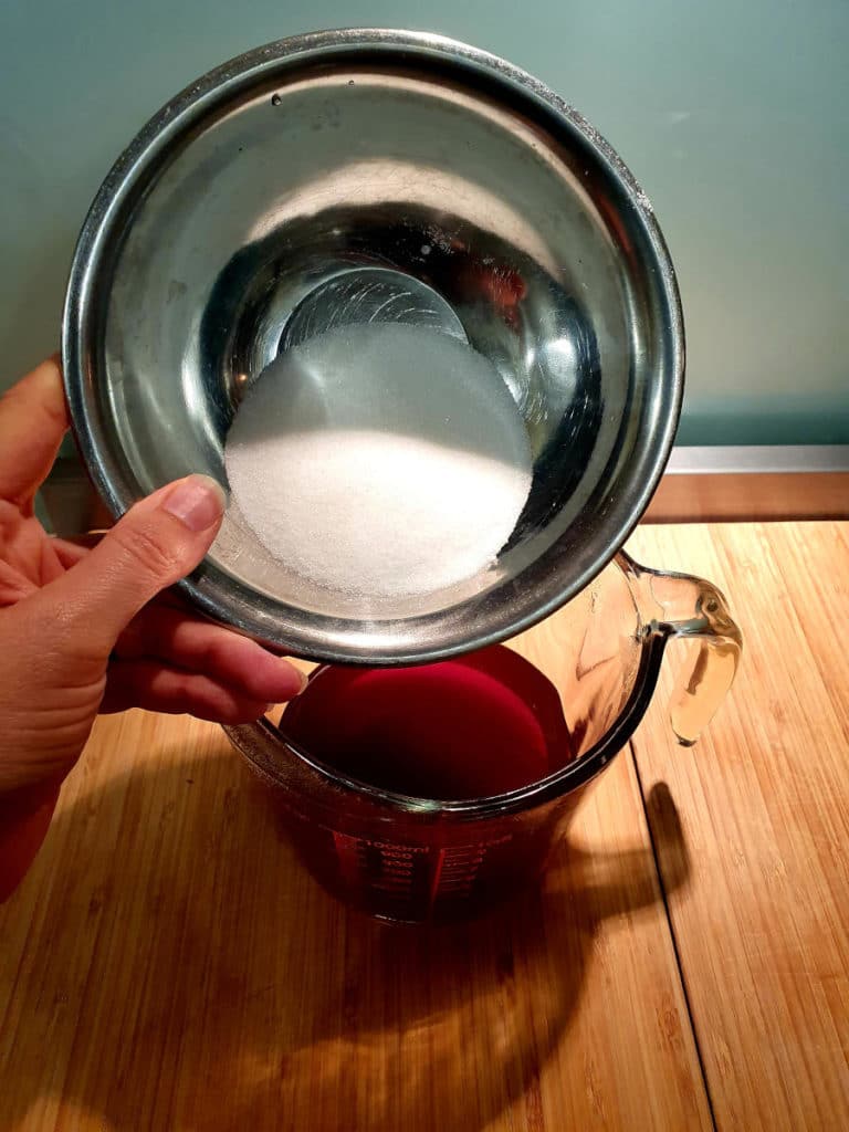 Lemon iced tea popsicles 5 Adding sugar to tea mix