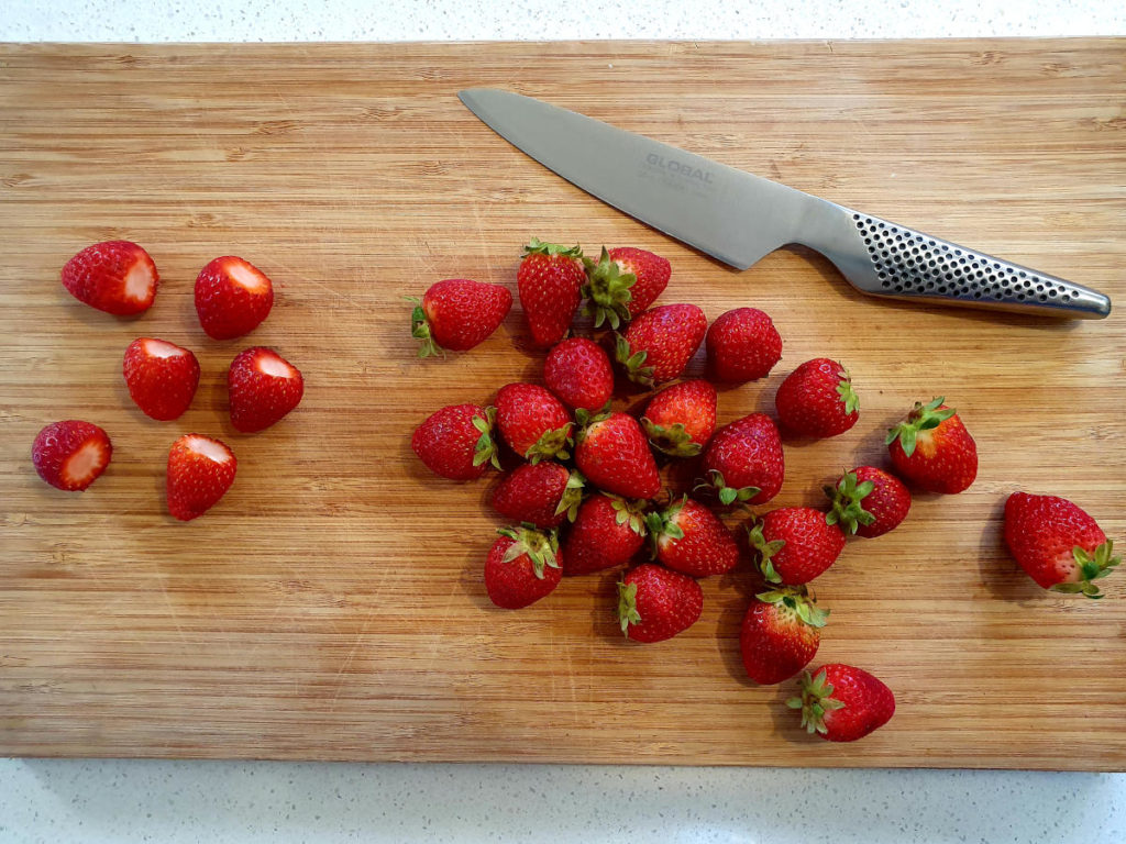 Strawberry, balsamic and black pepper popsicles 3 Cutting up strawberries