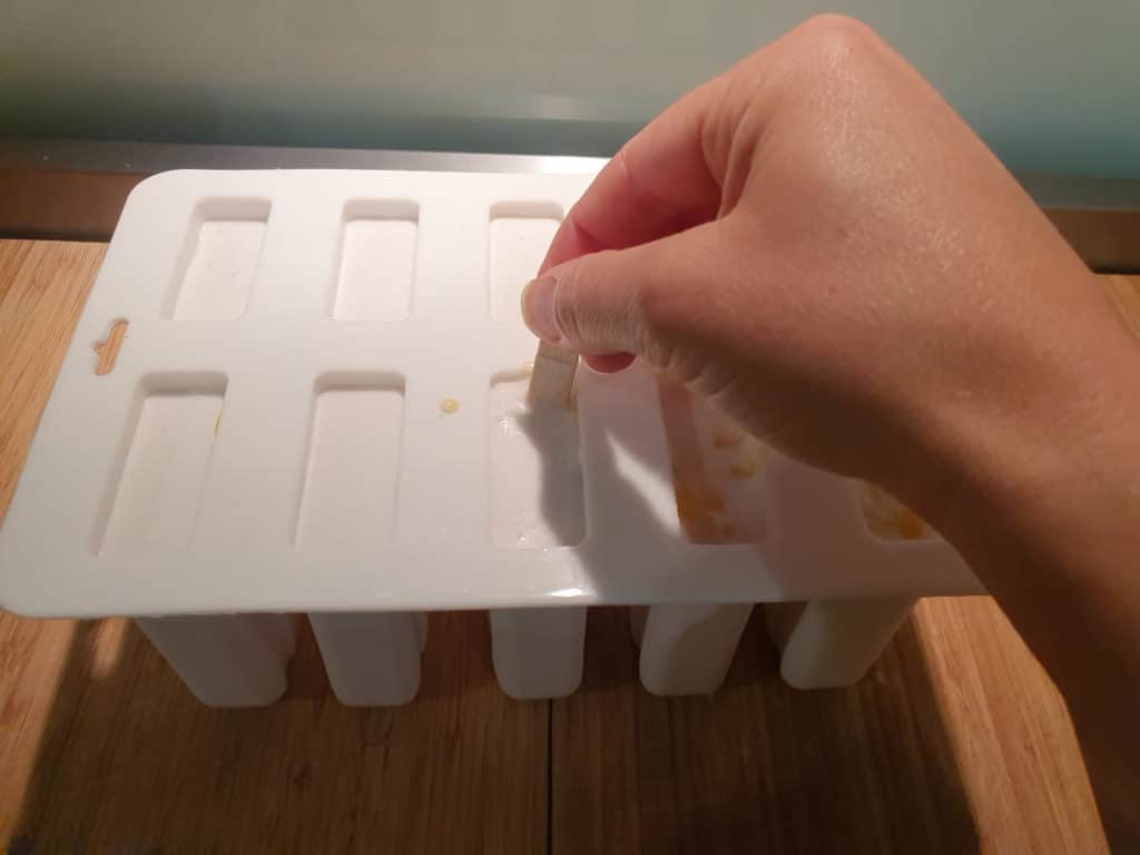 Mango coconut popsicles 8 Swirling-in-popsicle-layers