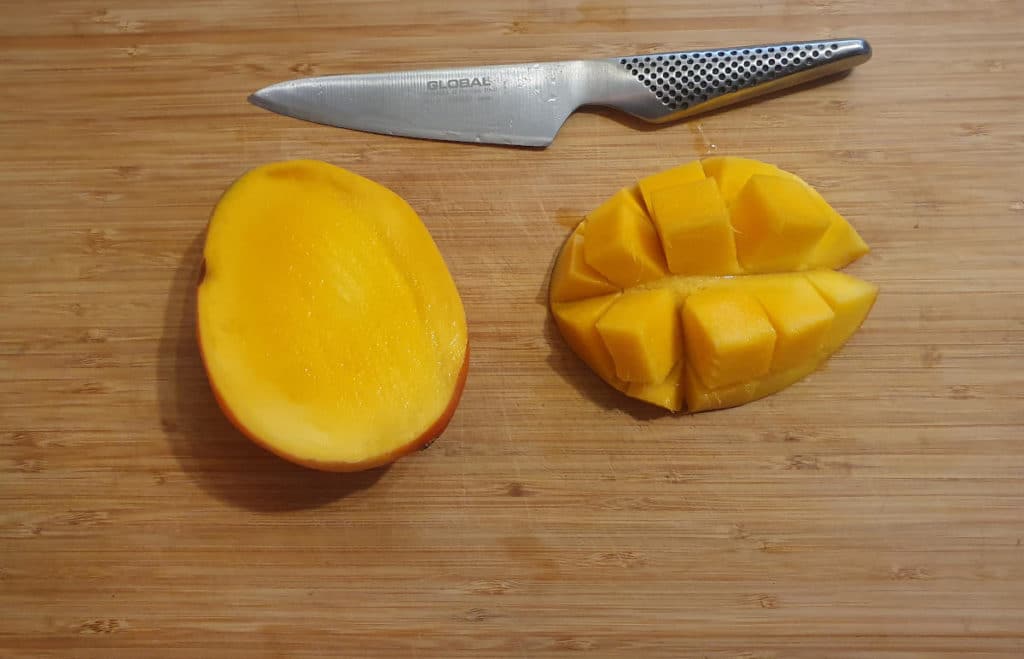 Mango coconut popsicles 3 Slicing mango