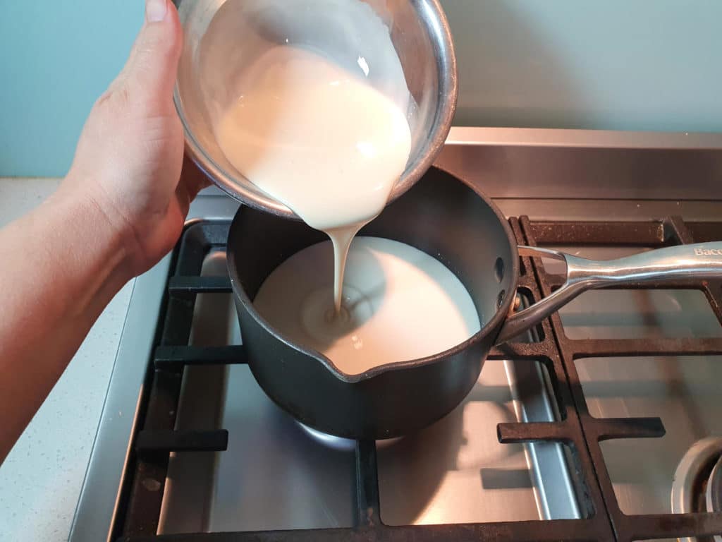 Sour Cream Ice Cream 4 Adding cream to pot