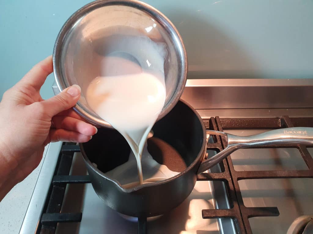 Adding milk to pot