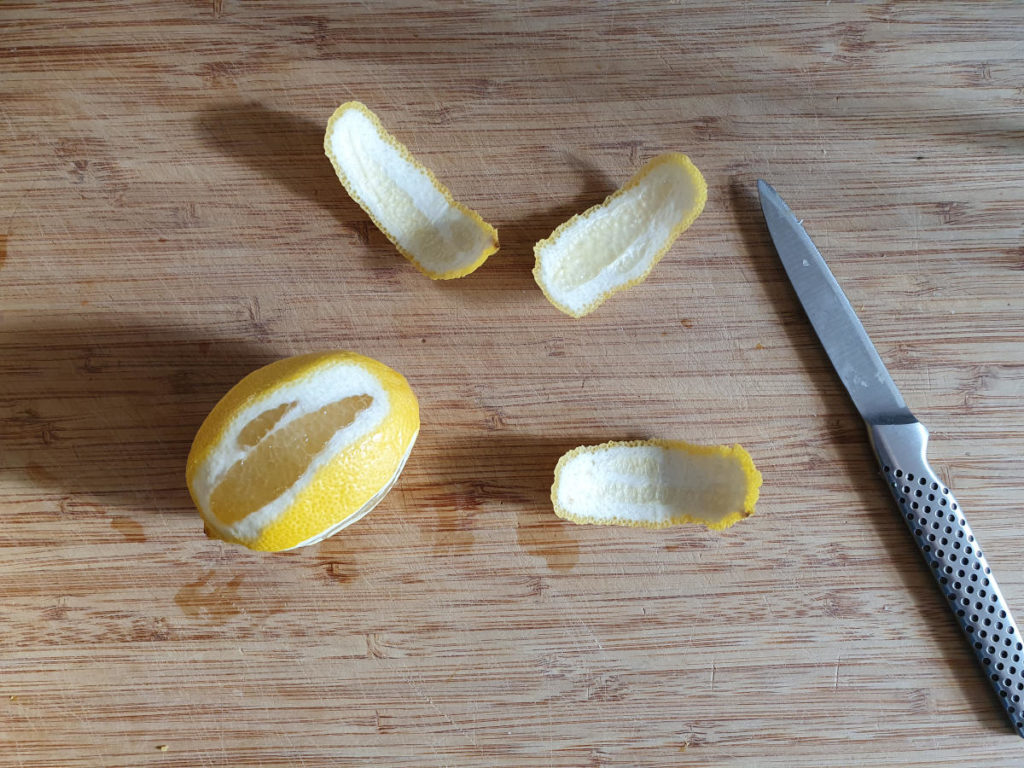Cutting zest strips off lemons