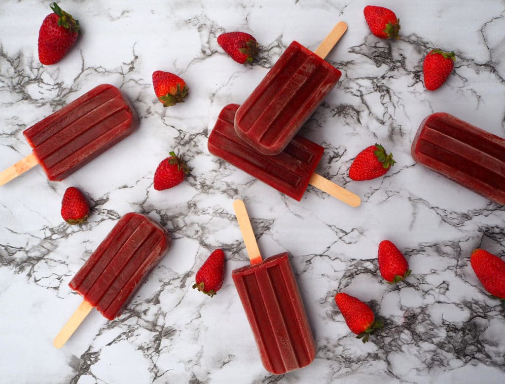 Strawberry balsamic black pepper popsicles with strawberries
