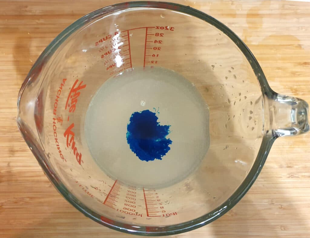 PJ Masks inspired popsicles 12 Adding blue colour to lemonade mix