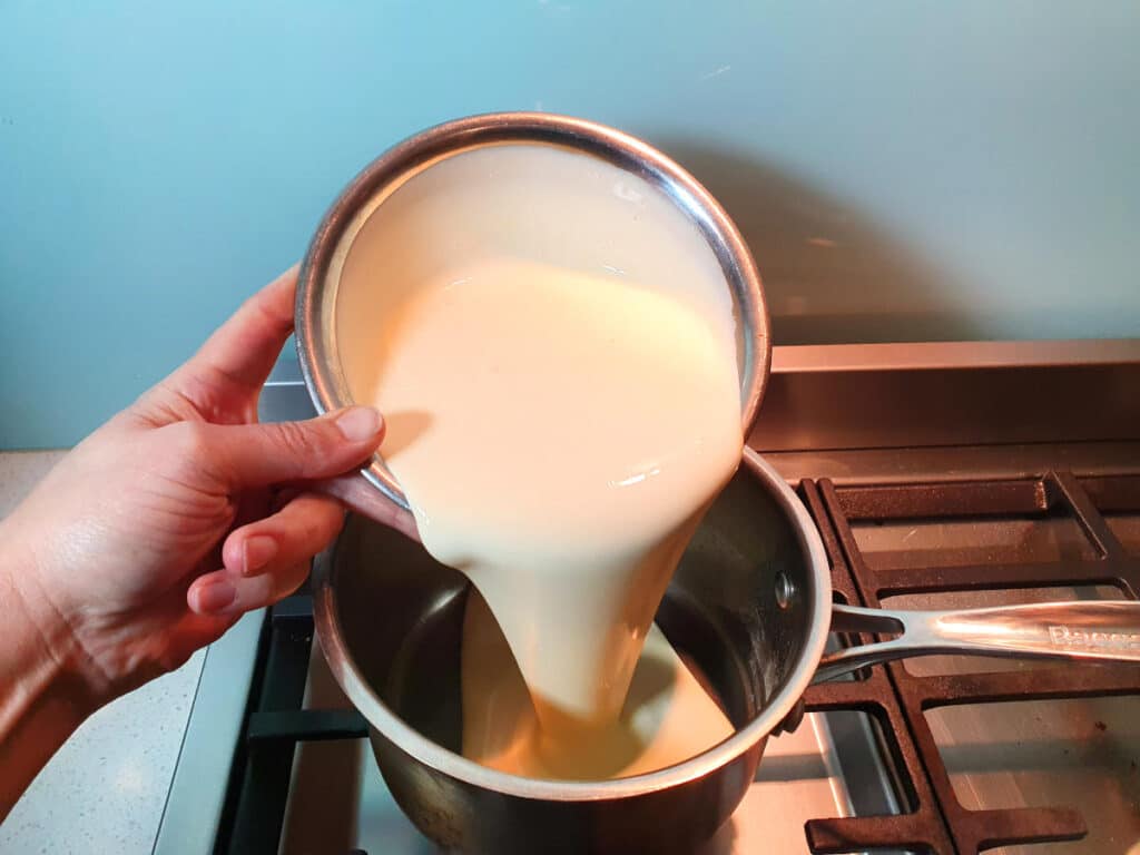 Adding cream to pot