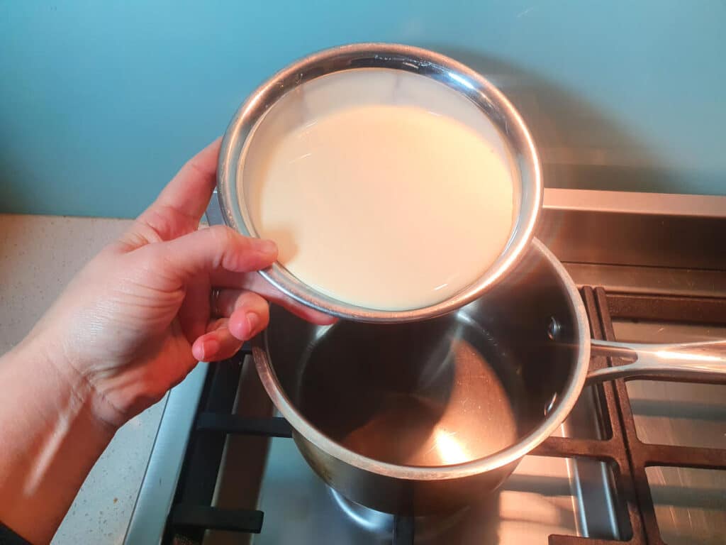 Adding cream to pot