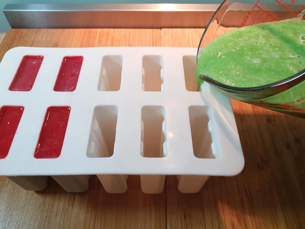 PJ Masks inspired popsicles 8 Adding owlet and geko mixes to popsicle moulds