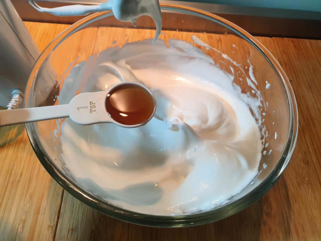Adding vanilla to meringue mix