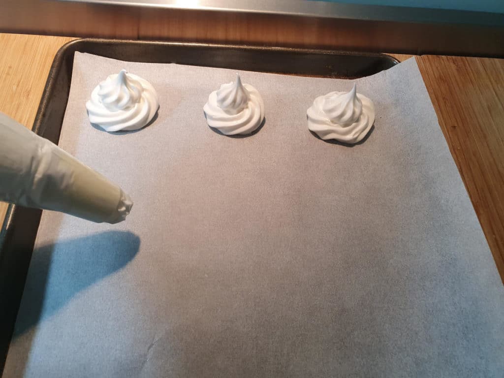 Pipping meringues onto baking tray