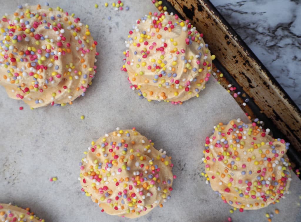 Rainbow meringues on tray