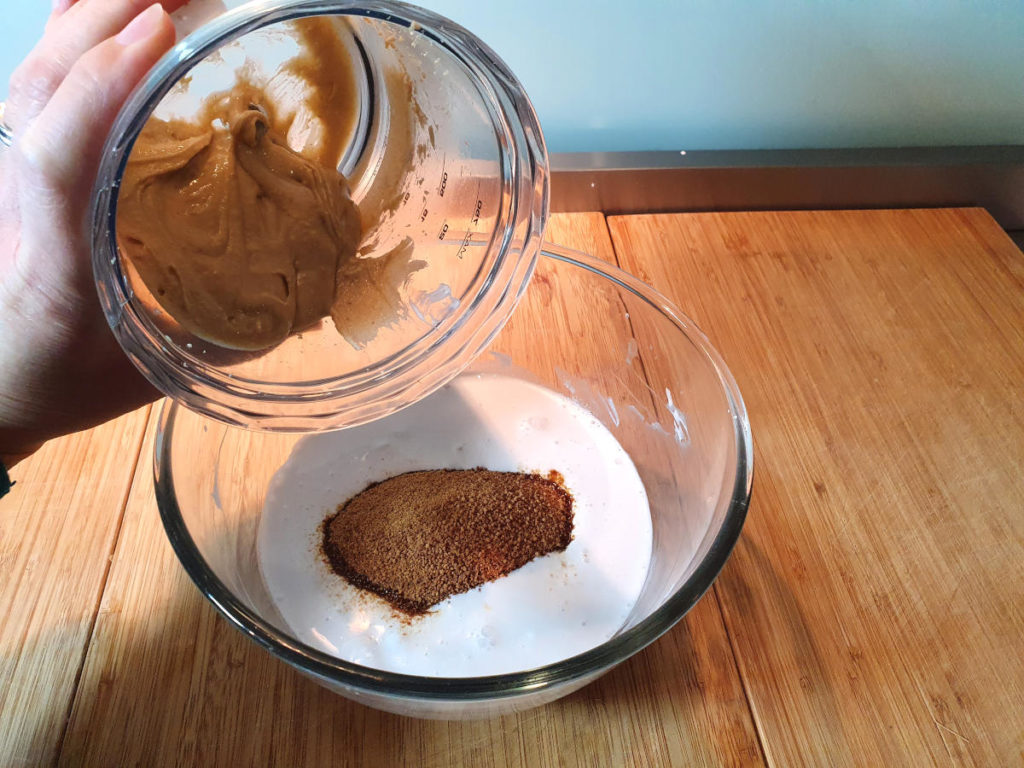 adding cashew butter to ice cream mix