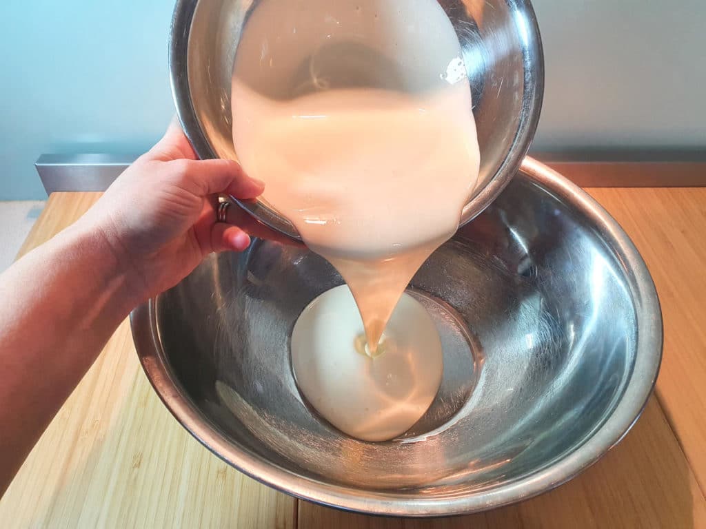 adding cream to bowl