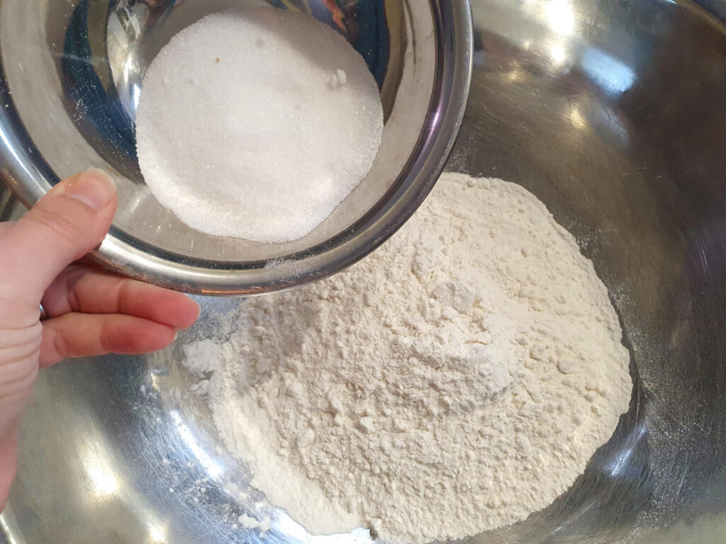 Adding sugar to flour for cobbler topping
