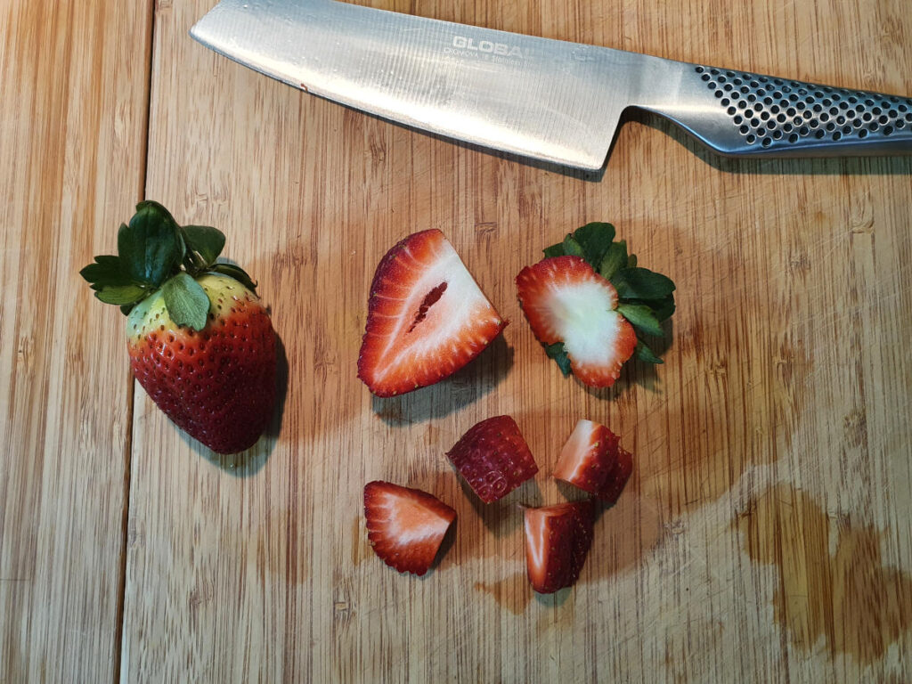cutting up strawberries