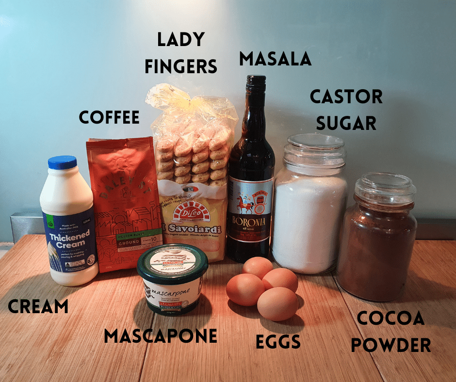 tiramisu ingredients, cream, coffee, lady fingers, mascarpone, eggs, masala, castor sugar, cocoa powder.