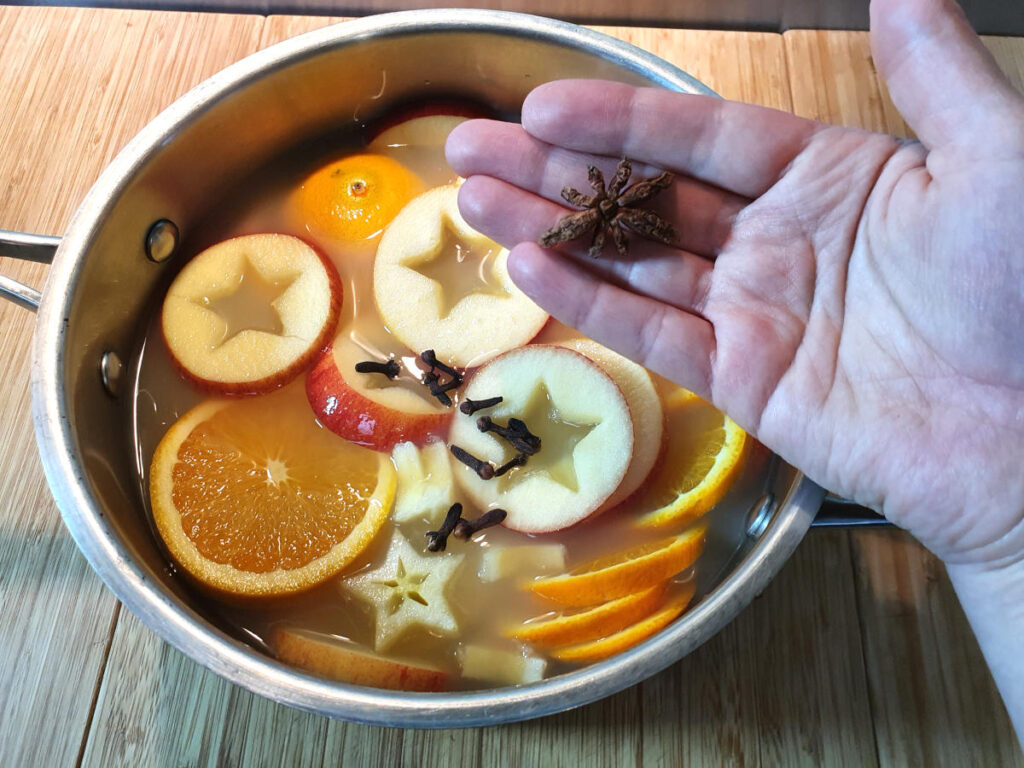 Adding star anise to pot.