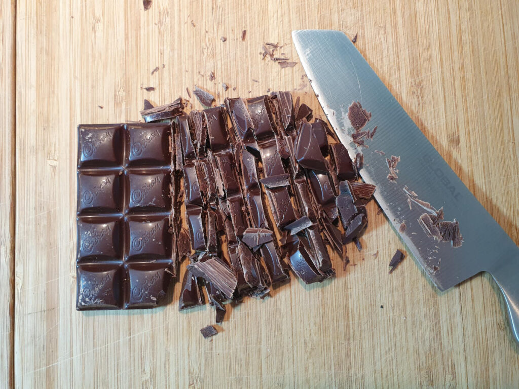 chopping dark chocolate.