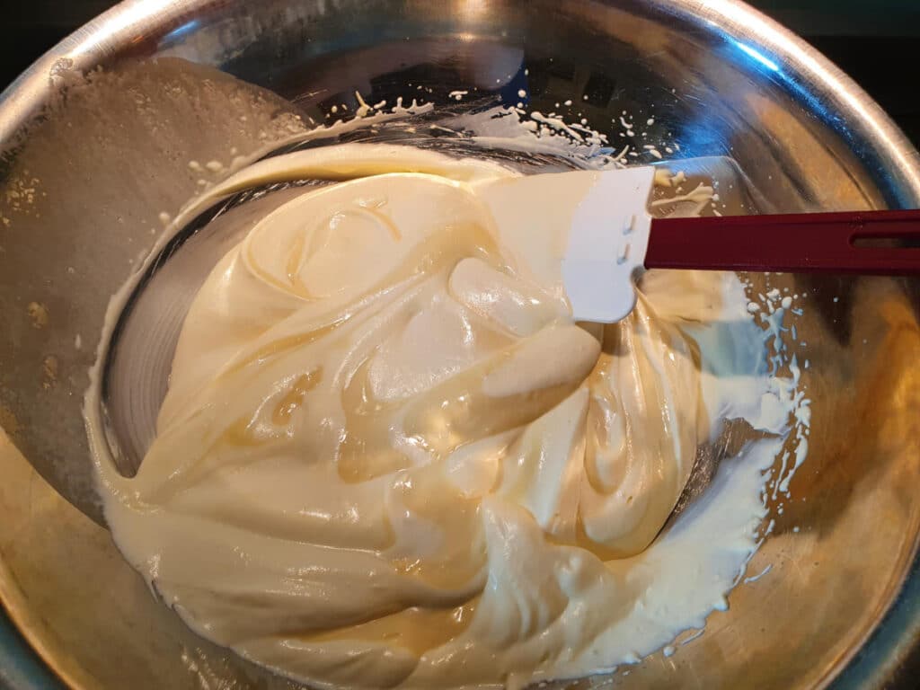 folding mascarpone mix into whipped cream.