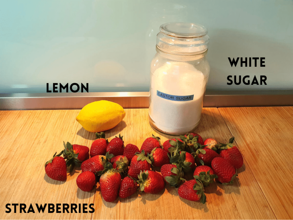 strawberry sauce ingredients, lemon, strawberries and white sugar.