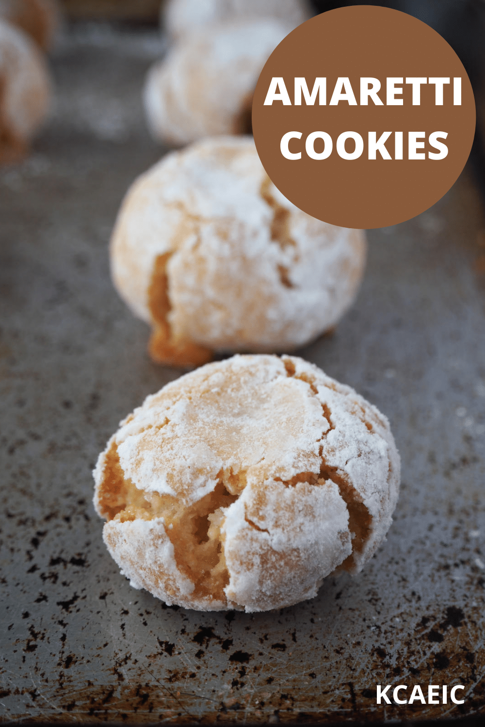 amaretti cookies on baking tray with text overlay, amaretti cookies and KCAEIC.