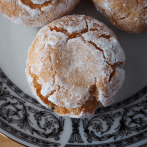 top down view close up amaretti cookies on a plate.