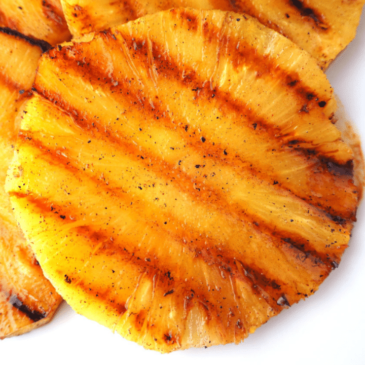 Close up top down view of grilled pineapple showing griddle lines.