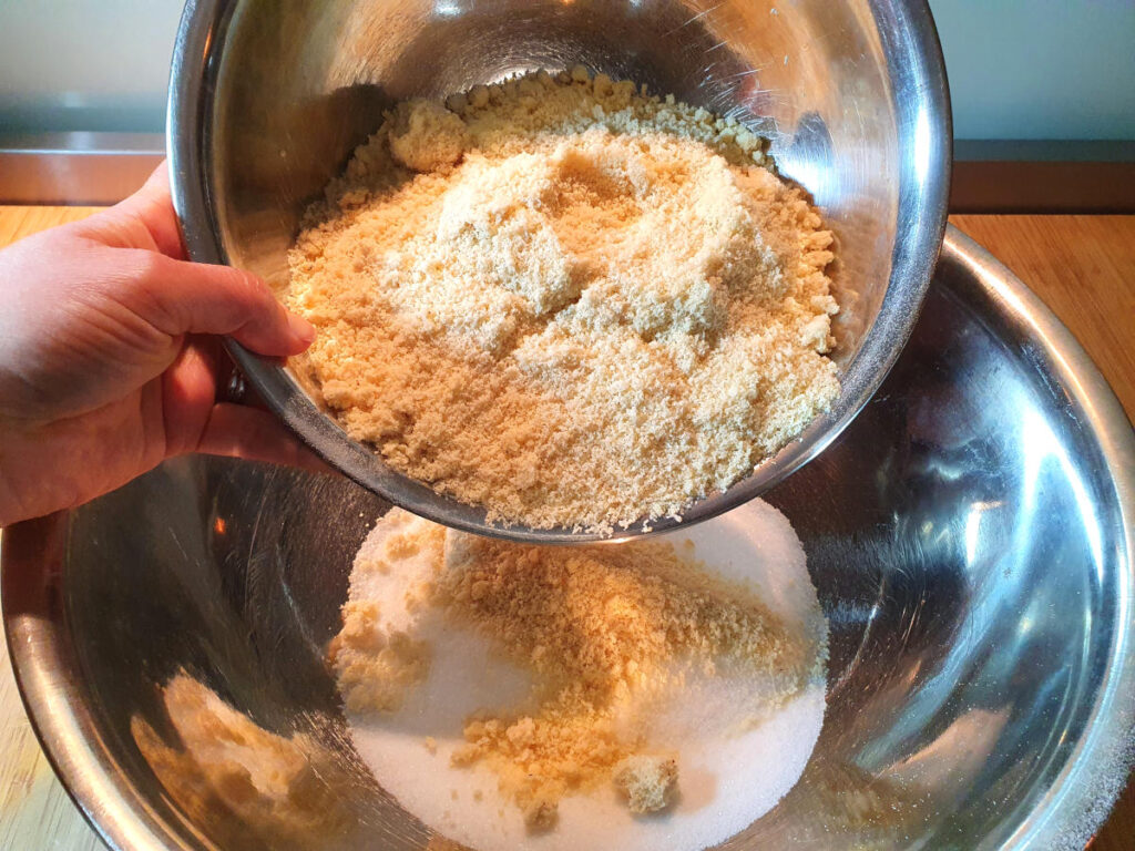 Amaretti cookies 7 adding almond meal to cookie mix.