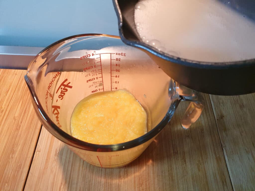 adding coconut milk mix to reduced pineapple.