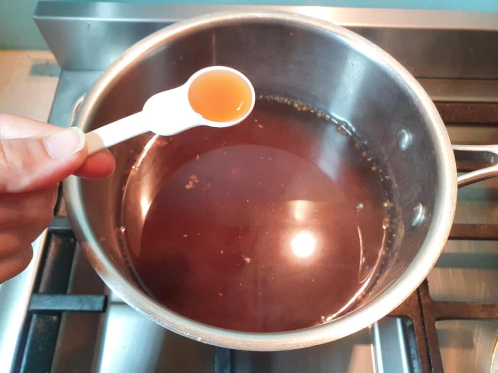 adding vanilla to saucepan.