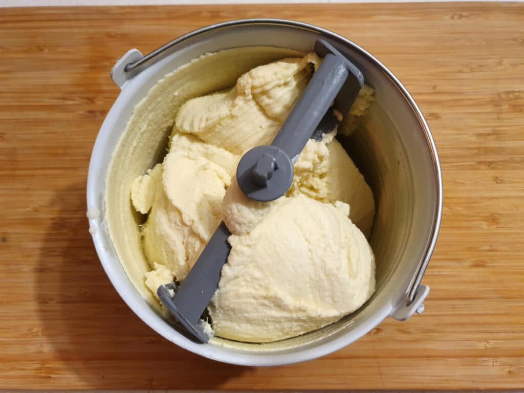 churned ice cream in churning bowl.