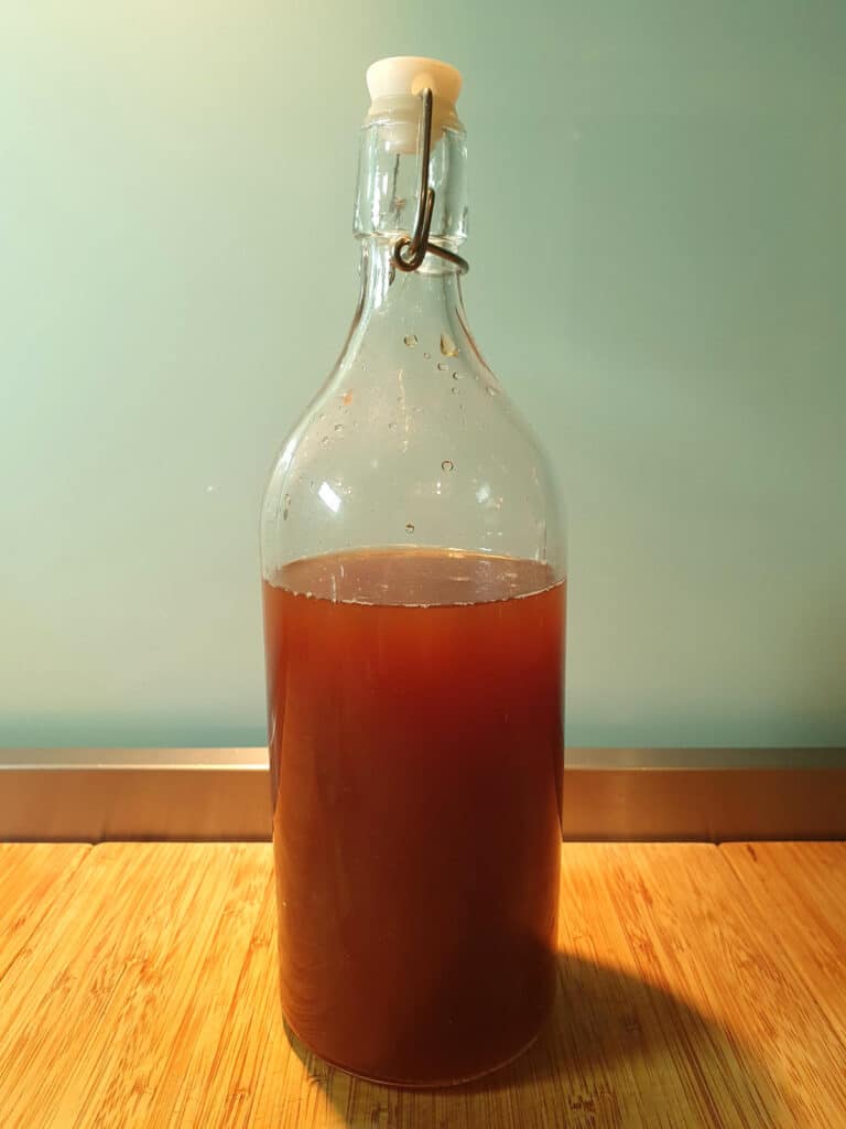 cola in jug with lid for storage in fridge