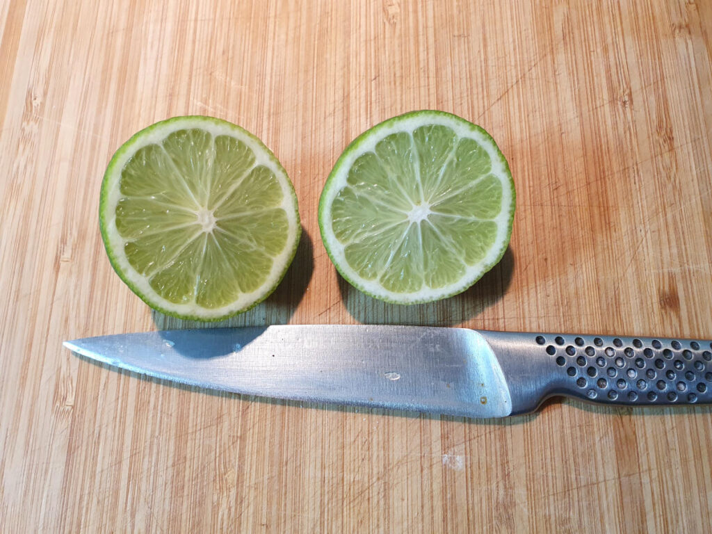 Pina colada ice cream 14 cutting up limes to juice.