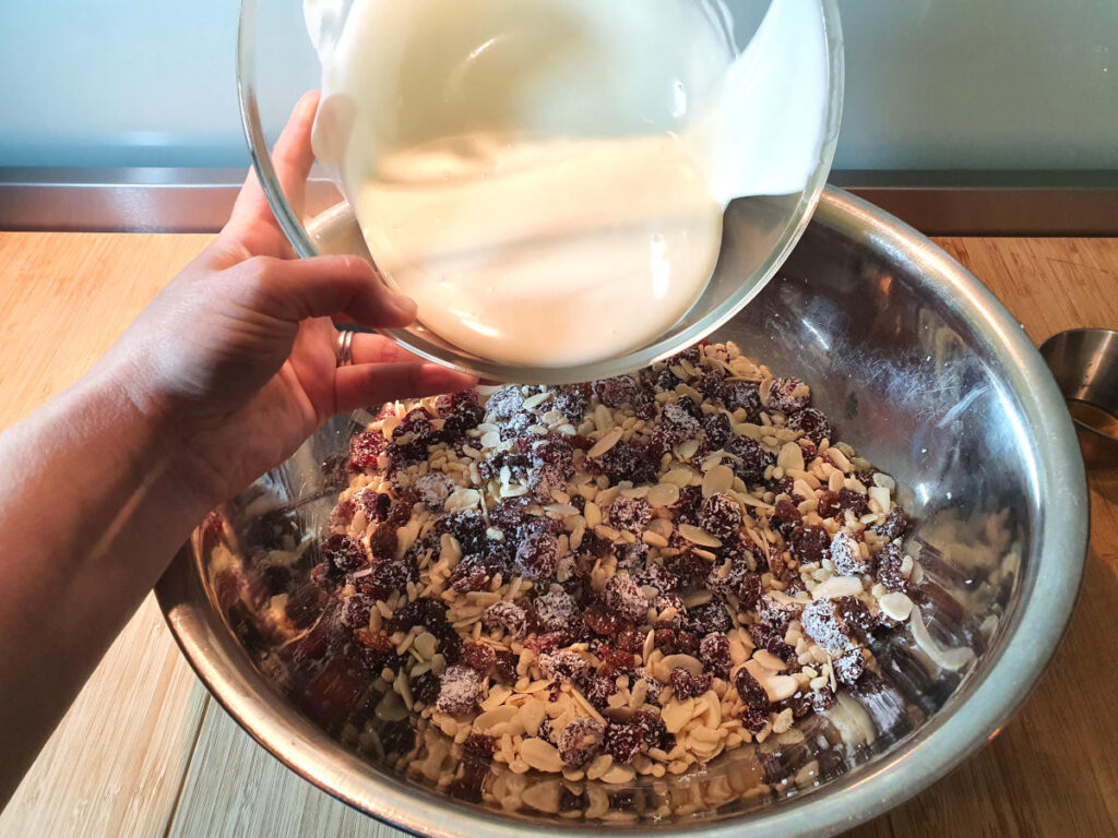 adding melted white chocolate to mix in bowl.