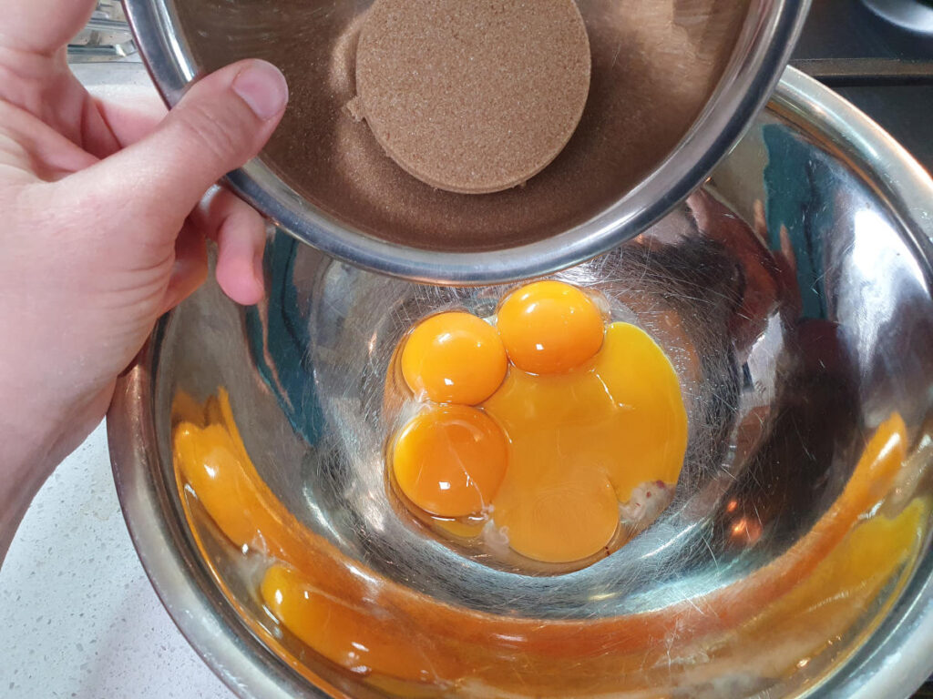 Gingerbread ice cream 6 adding brown sugar to egg yokes.