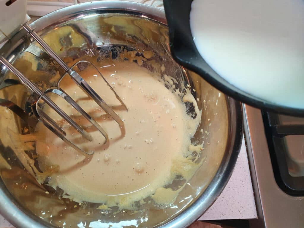 Gingerbread ice cream 9 Adding warm milk to sugar and yoke mix.