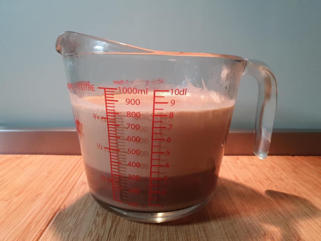 Milo ice cream 11 chilled ice cream mix that has separated a little and needs to be stirred before churning.