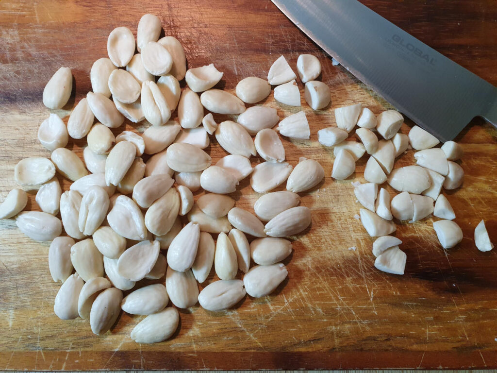 chopping blanched almonds with a sharp knife.