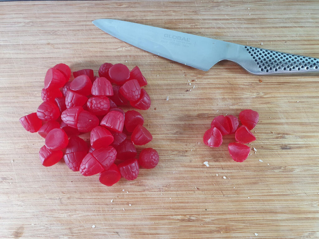 chopping up soft raspberry candies.