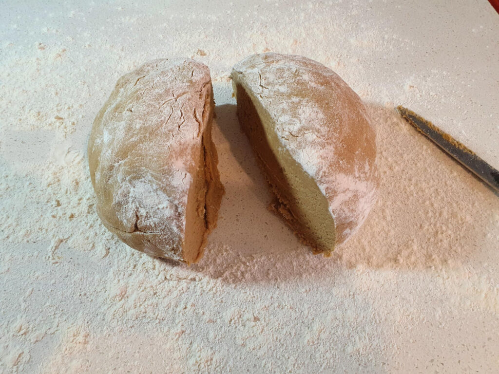 cutting shaped dough in half.