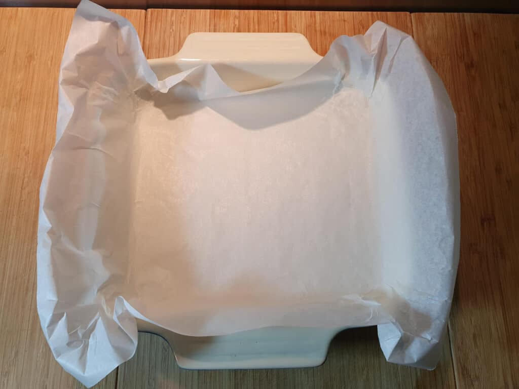 lining baking tray with baking paper.